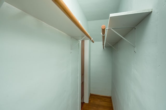 spacious closet featuring wood finished floors