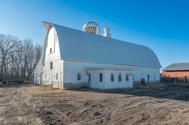 exterior space featuring an outbuilding and a barn