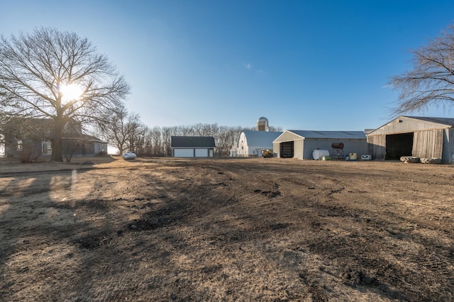 view of yard featuring an outbuilding and an outdoor structure