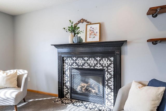 room details featuring carpet floors, a fireplace, and baseboards