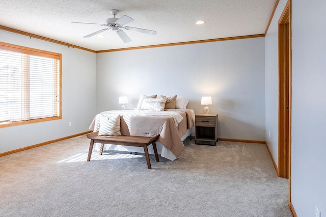 bedroom featuring ornamental molding, light colored carpet, and baseboards