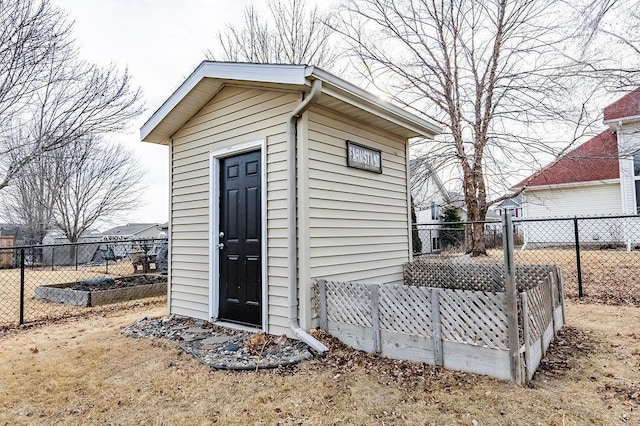 view of shed with a fenced backyard