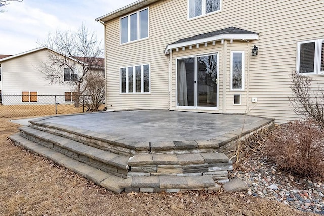 rear view of property with a patio area and fence