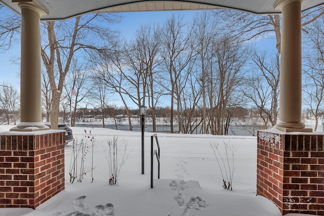 view of yard layered in snow