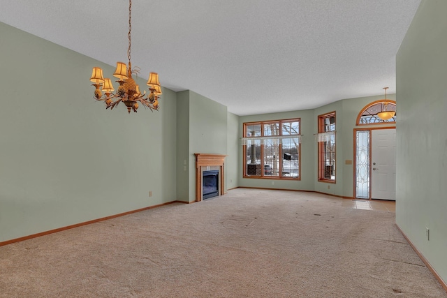 unfurnished living room featuring a fireplace, baseboards, and carpet flooring