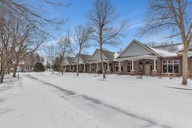 exterior space featuring brick siding