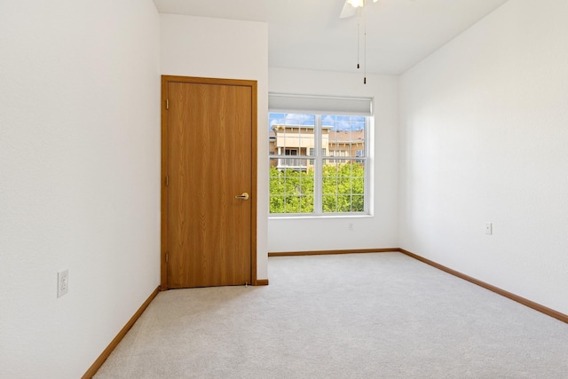 600 Greenhaven Dr Unit 209, Burnsville, MN 55306 - spare room featuring carpet flooring, baseboards, and a ceiling fan