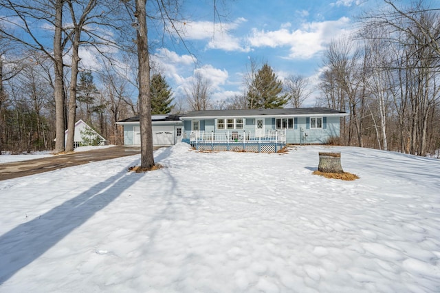 view of front of property featuring a porch and an attached garage