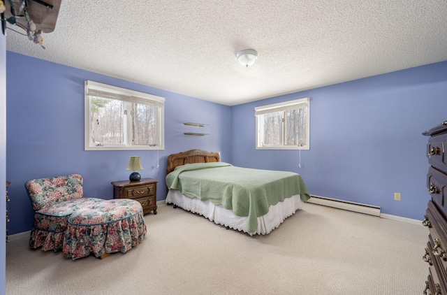 carpeted bedroom featuring a baseboard radiator, baseboards, and a textured ceiling