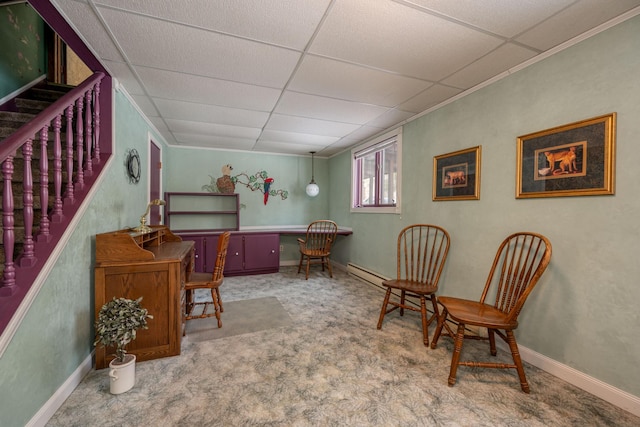 sitting room with carpet floors, a baseboard radiator, stairway, and a drop ceiling