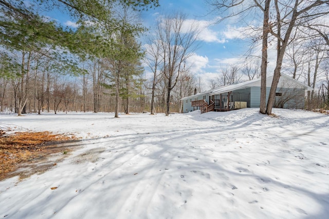 yard covered in snow with a garage