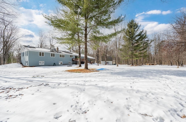 view of yard layered in snow