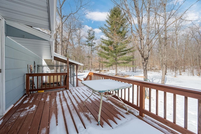 view of snow covered deck