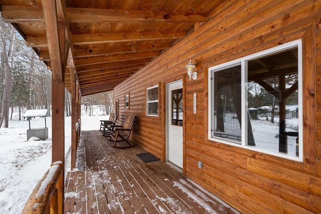 view of snow covered deck