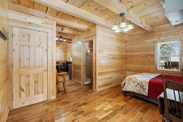 bedroom with wooden ceiling, wood walls, light wood-style flooring, and beamed ceiling