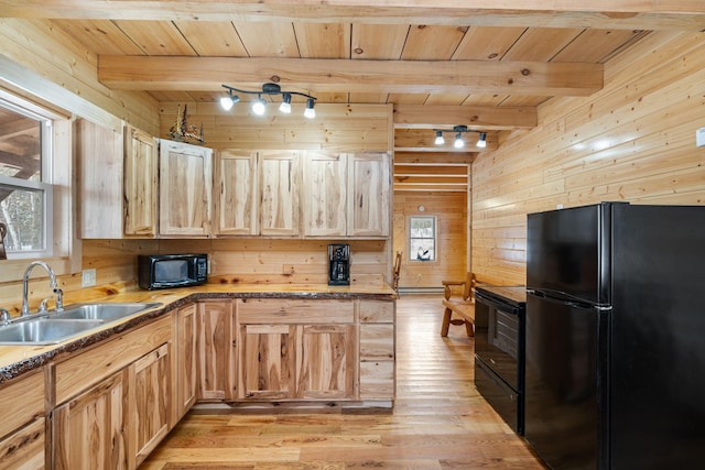 kitchen with beamed ceiling, wooden ceiling, a sink, and black appliances