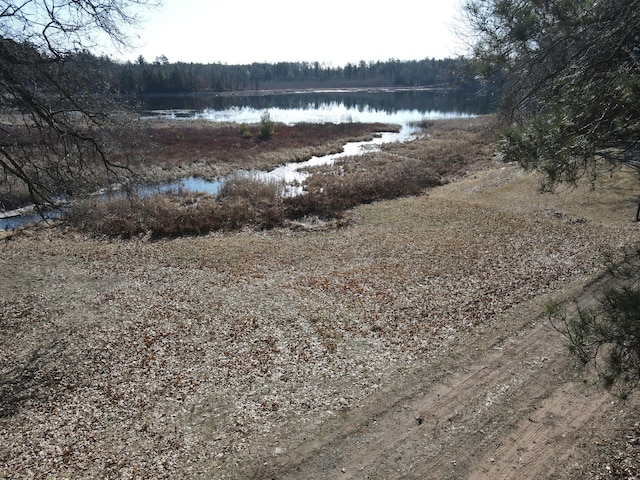 exterior space featuring a forest view