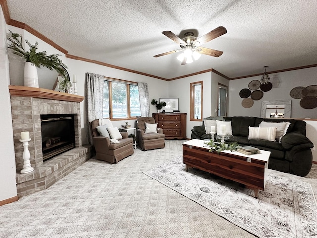 living area featuring carpet floors, a textured ceiling, a fireplace, and crown molding