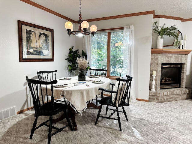 dining space with visible vents, ornamental molding, an inviting chandelier, carpet flooring, and a fireplace