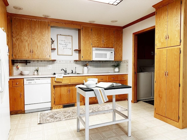 kitchen featuring light floors, white appliances, a sink, and light countertops