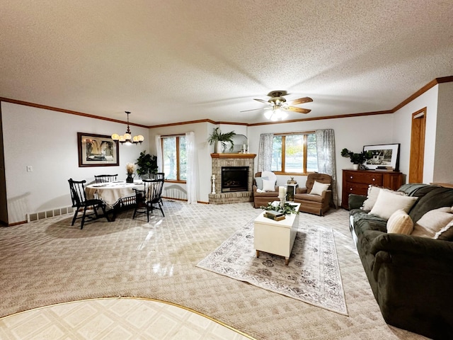 living area with a wealth of natural light, a brick fireplace, carpet flooring, and visible vents