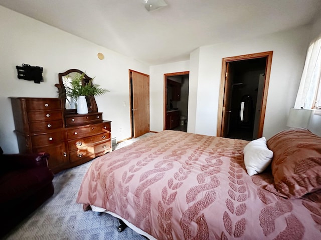 bedroom featuring carpet and ensuite bathroom