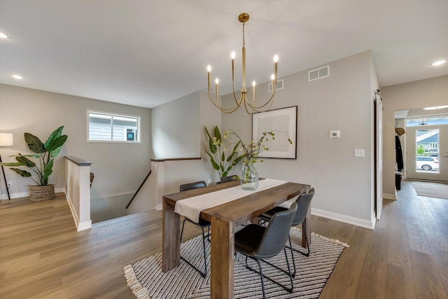 dining space with baseboards, visible vents, wood finished floors, and recessed lighting