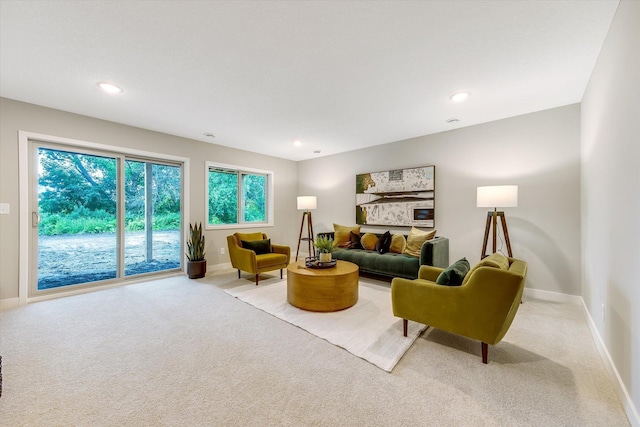 living area featuring recessed lighting, carpet, and baseboards