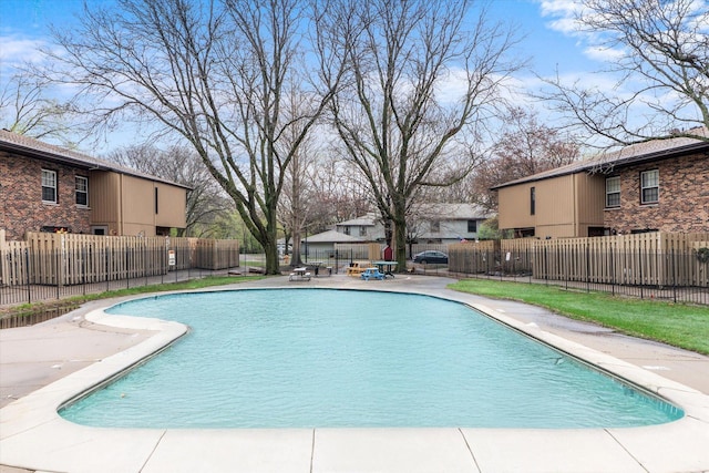 view of pool with a fenced in pool, fence, and a patio
