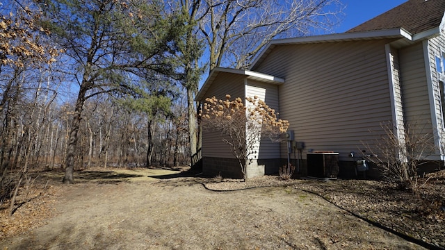 view of side of property with cooling unit