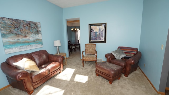 living area with baseboards, carpet flooring, visible vents, and a notable chandelier