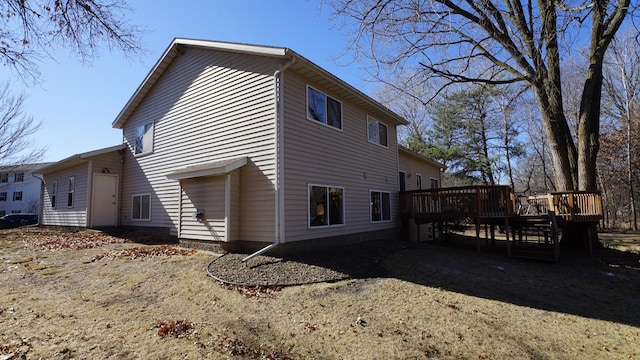 view of side of property featuring a deck