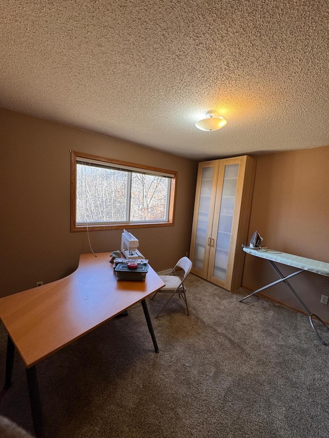 office featuring a textured ceiling, french doors, and carpet flooring