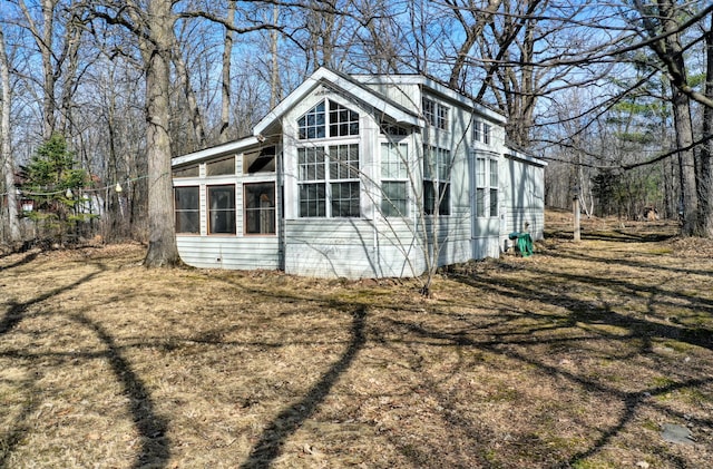 exterior space featuring a sunroom