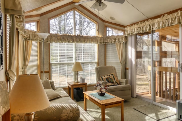 sunroom with vaulted ceiling and a ceiling fan