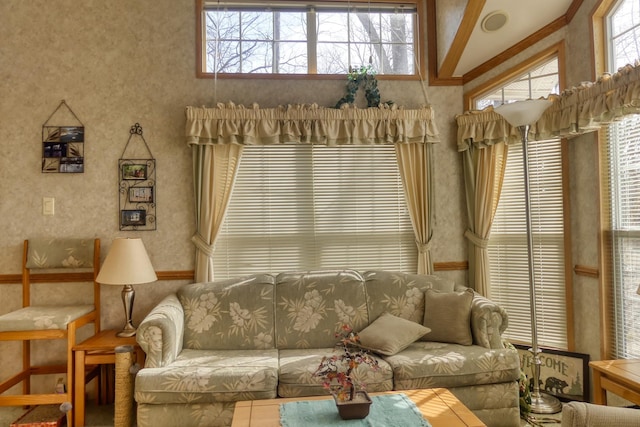 living area with a towering ceiling