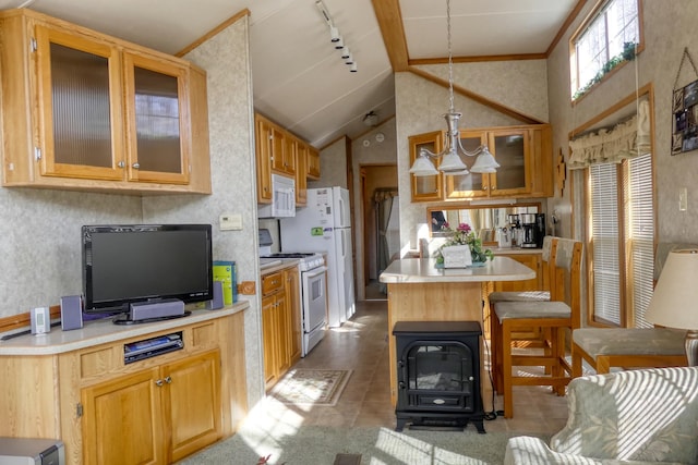 kitchen with a kitchen island, white appliances, a breakfast bar area, light countertops, and glass insert cabinets