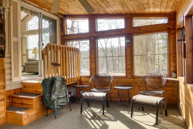 sunroom featuring wood ceiling