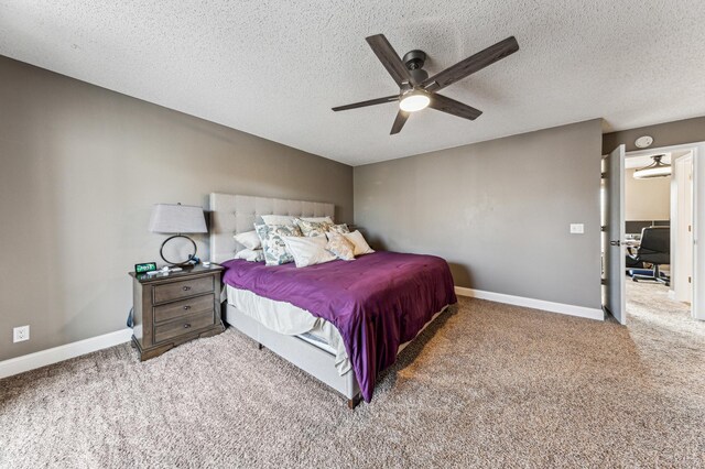 carpeted bedroom with baseboards, a textured ceiling, and ceiling fan