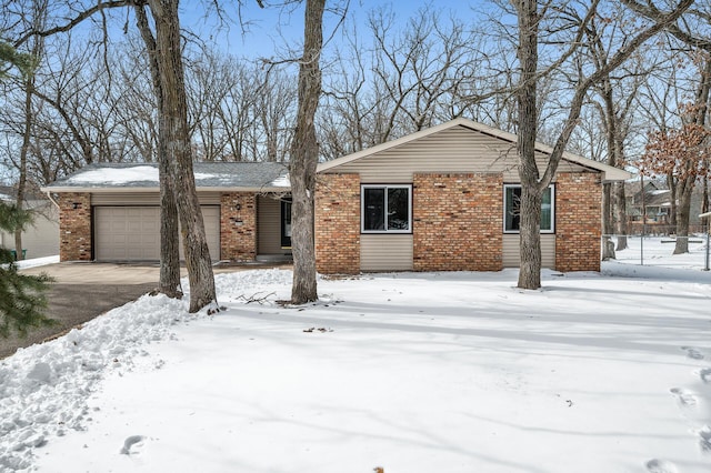 view of front of house featuring a garage and brick siding