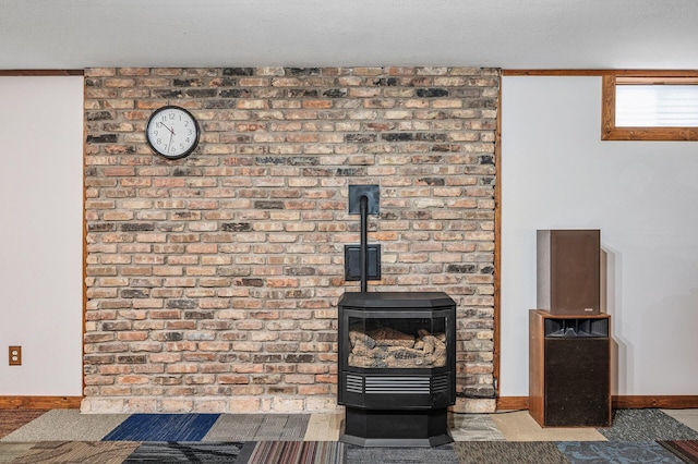 interior details with a wood stove, carpet, baseboards, and a textured ceiling