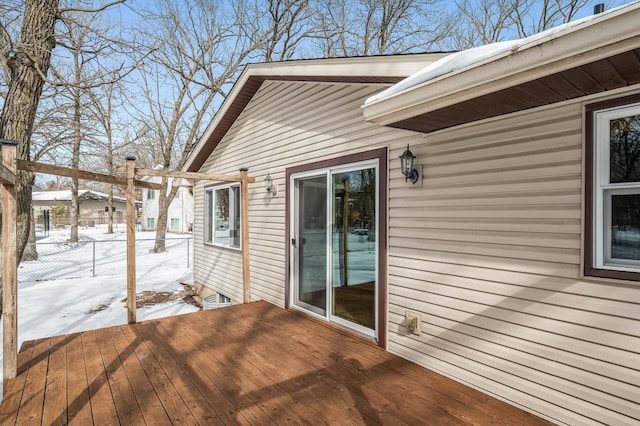 snow covered deck with fence