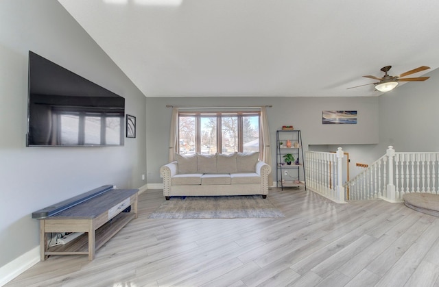 unfurnished living room with wood finished floors and baseboards