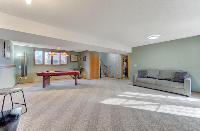 playroom featuring carpet floors, billiards, and a textured ceiling