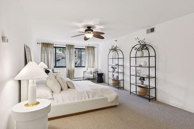 bedroom with ceiling fan, carpet floors, visible vents, and baseboards