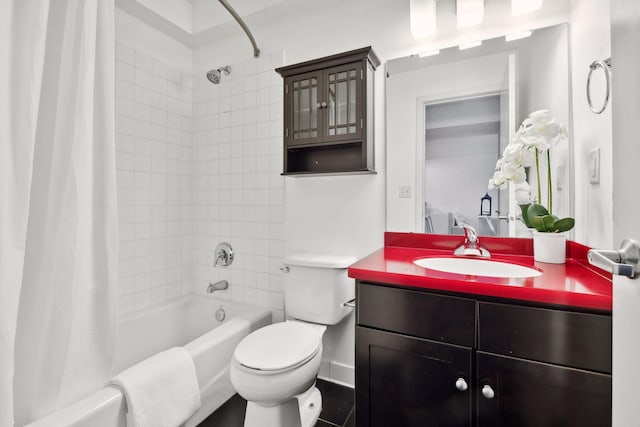 full bathroom with vanity, shower / bath combo with shower curtain, toilet, and baseboards