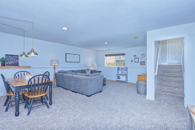 living area featuring stairway, carpet flooring, and recessed lighting