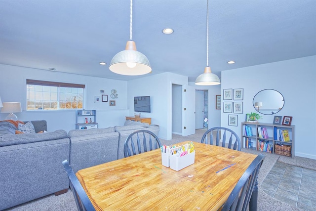 dining room featuring baseboards and recessed lighting