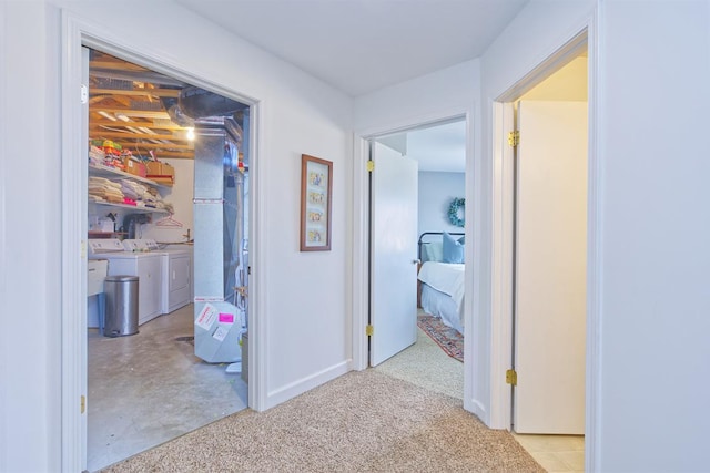 hallway with separate washer and dryer