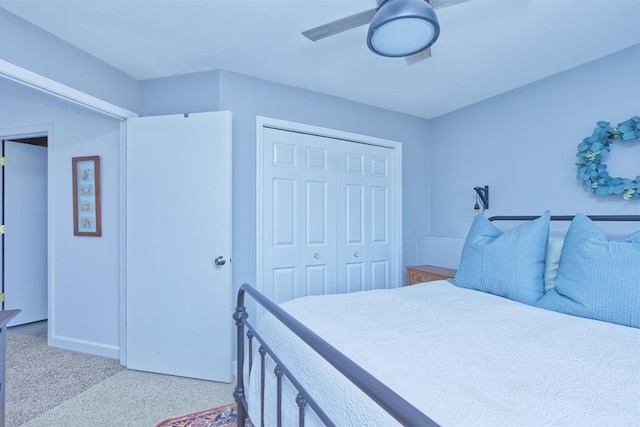 bedroom with carpet floors, a closet, and a ceiling fan